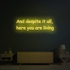 And Despite It All Here You Are Living” Neon Sign – Inspirational LED Wall Art
